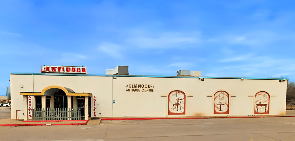 Elmwood Antique Centre storefront in Abilene, TX with vintage murals and antique signage
