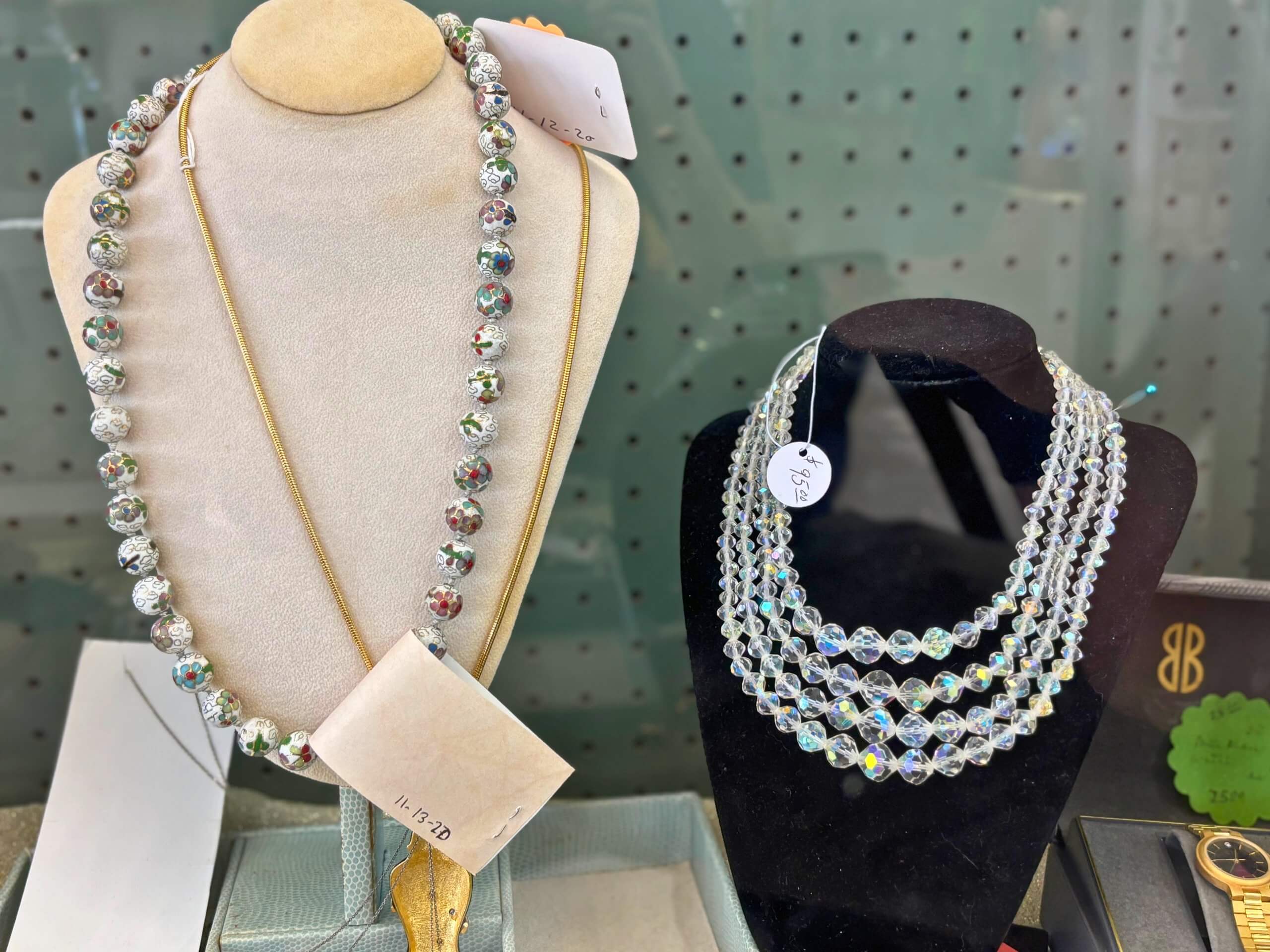 Vintage crystal bead necklaces on velvet busts at Elmwood Antique Centre in Abilene, TX