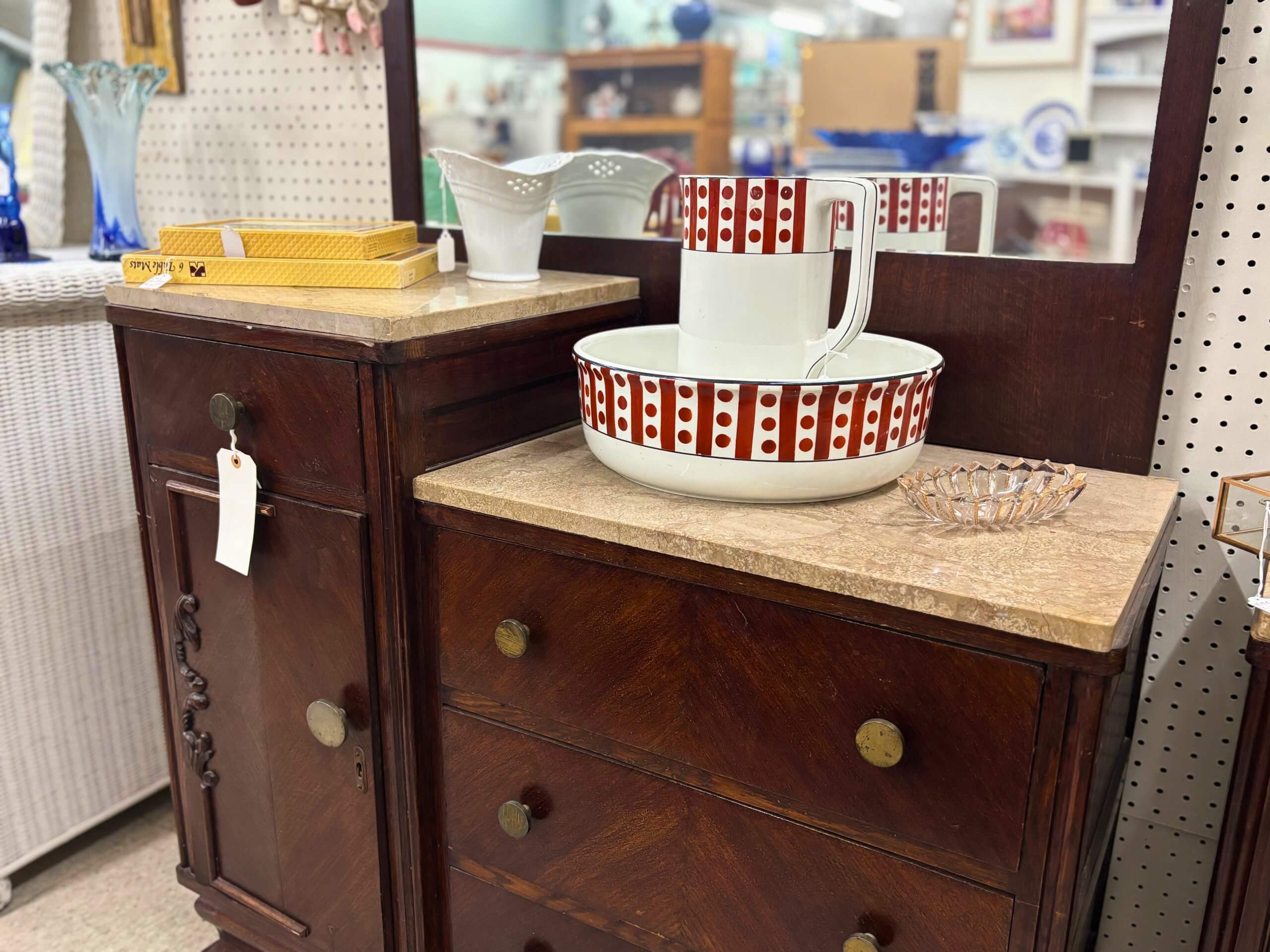 Antique marble-top dresser with red and white ceramic pitcher and bowl set at Elmwood Antique Centre in Abilene, TX
