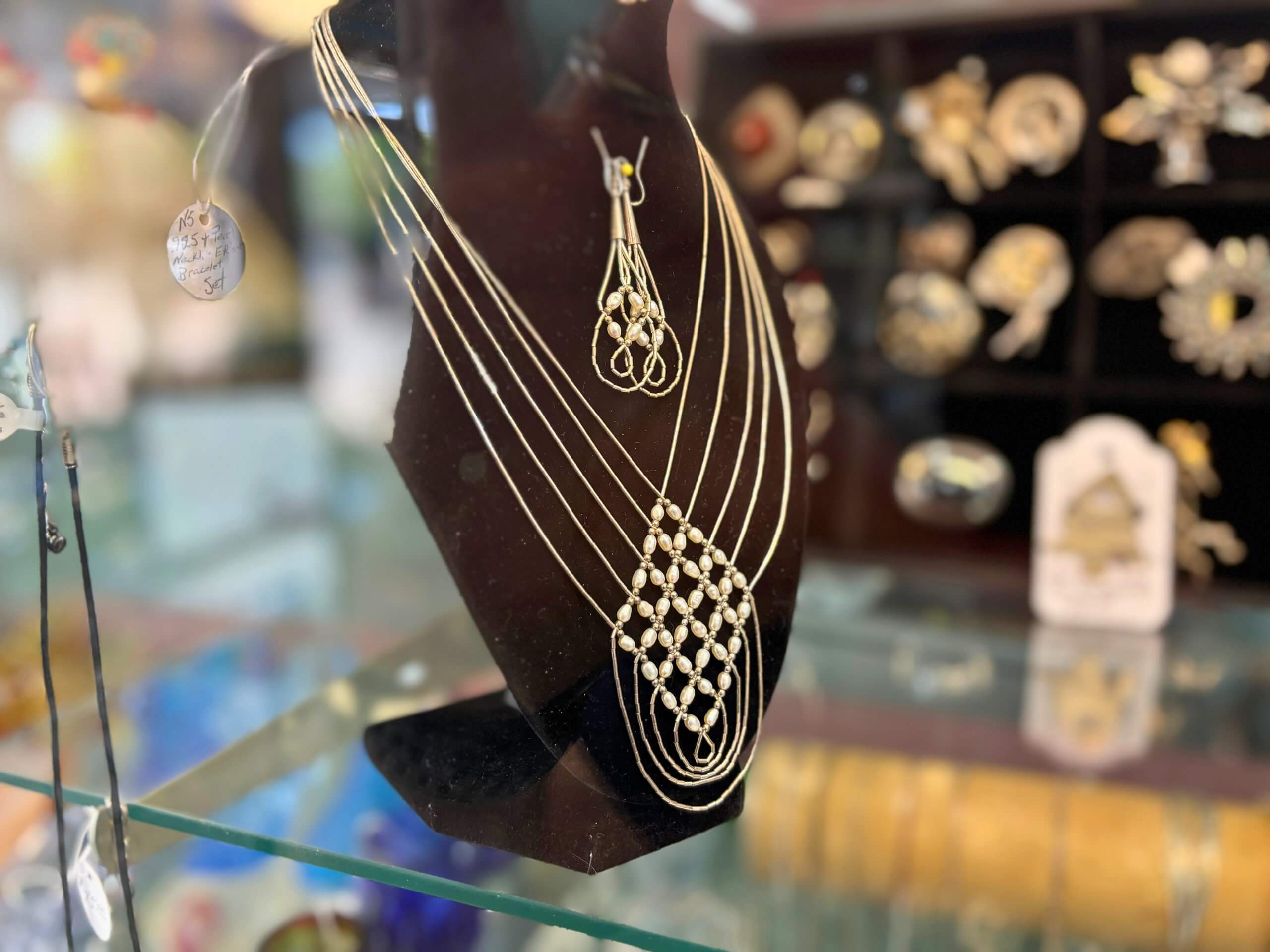 Elegant vintage necklace and earring set on display at Elmwood Antique Centre in Abilene, TX