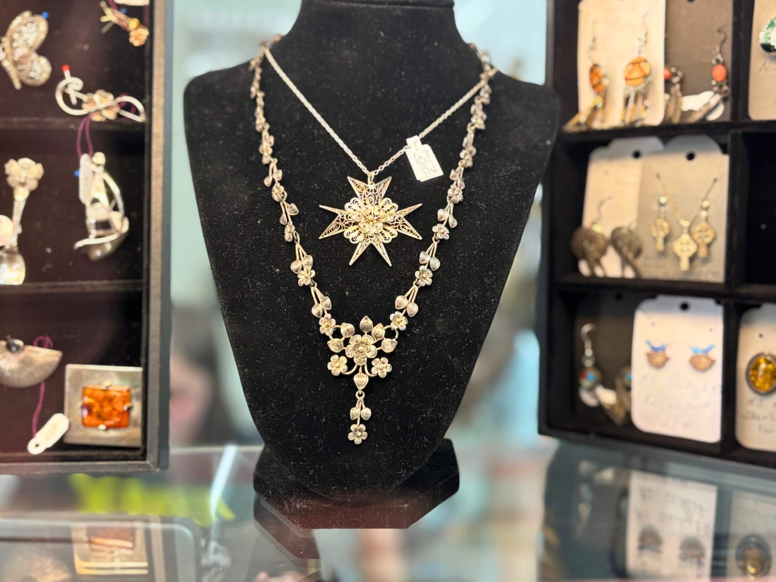 Ornate square gold picture frame with vintage floral carvings from Elmwood Antique Centre in Abilene, TX