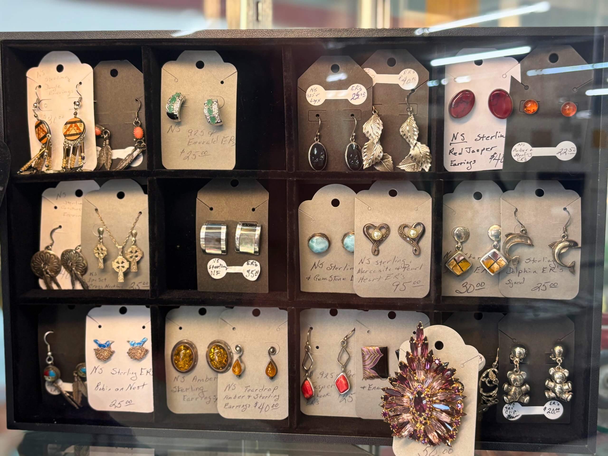Display of vintage and sterling silver earrings at Elmwood Antique Centre in Abilene, TX